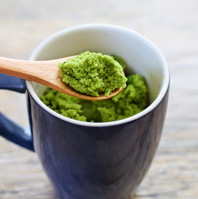 close-up of a spoon with match green tea cake