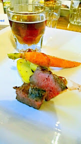 Sample of the cast iron Wagyu top sirloin steak at Kells Brew Pub with heirloom baby carrots, fingerling potatoes, and bordelaise sauce