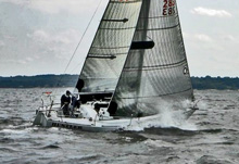 J/29 Hustler sailing fast upwind on Long Island Sound