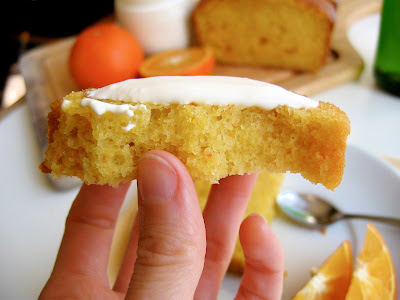 slice of tangerine olive oil pound cake with bite taken out 