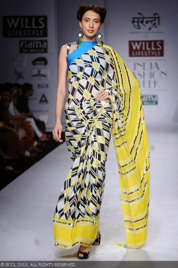Alesia Raut showcases a creation by fashion designer Yogesh Chaudhary on Day 4 of Wills Lifestyle India Fashion Week (WIFW) Spring/Summer 2014, held in Delhi.