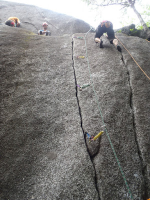 The gear from my lead up the 5.8 left side crack, while Aaron checks out the right side crack