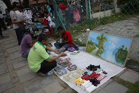painting for sale at an outdoor market in George Town, Penang, Malaysia