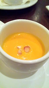 Brasserie Montmartre Amuse Bouche of carrot ginger soup with vegetable stock, cauliflower for texture, hazelnut for crunch