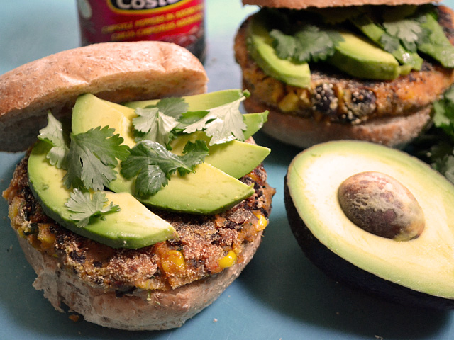 two Chipotle Sweet Potato Burgers topped with avocado 