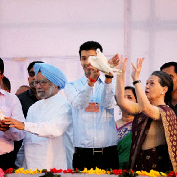 Prime Minister Manmohan Singh and UPA Chairperson Sonia Gandhi release white pigeons during Dussehra celebrations at Subhash Maidan in New Delhi on Sunday.