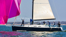 J/122 racer cruising sailboat- sailing Lake Texoma, Texas under spinnaker