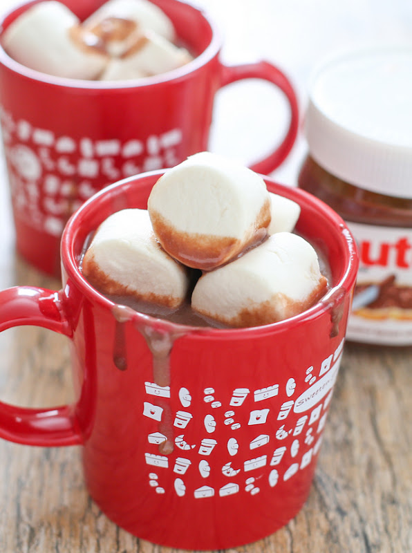 photo of mugs of hot chocolate topped with large marshmallows
