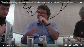Aus Video: Patrick Köbele mit Mikrofon.