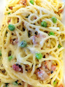 Spaghetti Carbonara with bacon, peas, parmesan, egg