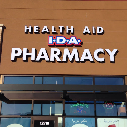 Health Aid Pharmacy logo