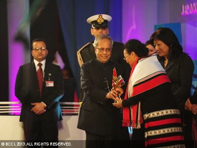 President Pranab Mukherjee gives away the lifetime achievement award during the Times of India Social Impact Awards, held in Delhi. 