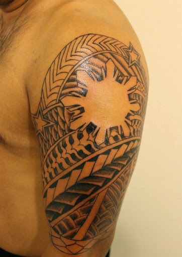 Filipino tribal tattoos on his sleeve