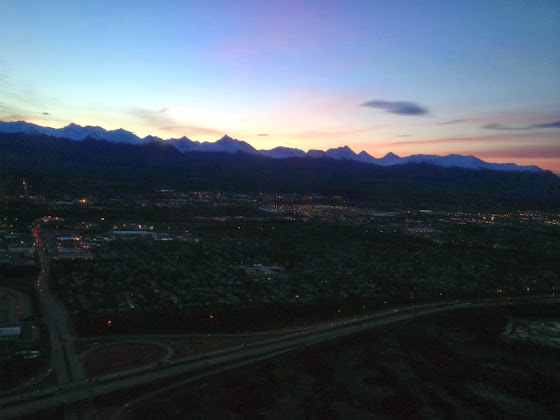 We're airborne with Anchorage just below just before dawn.