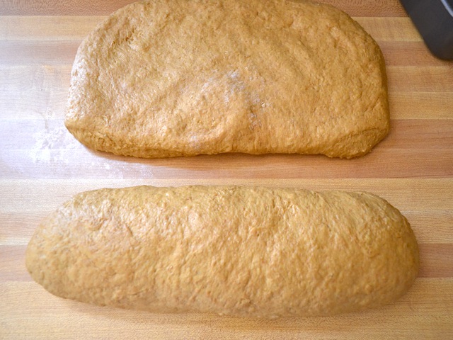 two pieces of dough being shaped into loaves