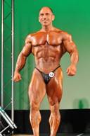 Sexy Competitive Male Bodybuilder Posing on Stage