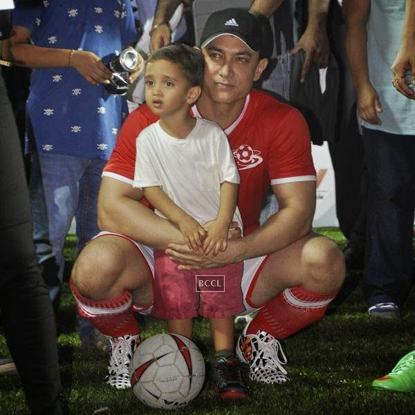 Aamir Khan clicked with his son Azaad during a charity soccer match organised by his daughter Ira Khan, at Cooperage ground, on July 20, 2014.(Pic: Viral Bhayani)
