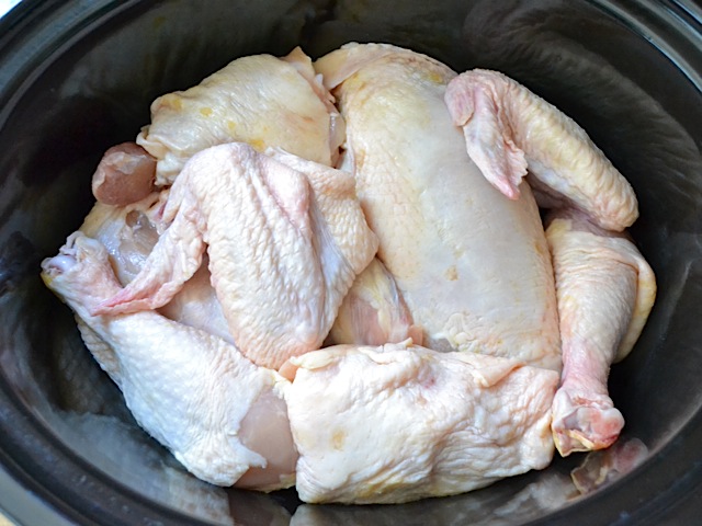 chicken arranged in slow cooker 