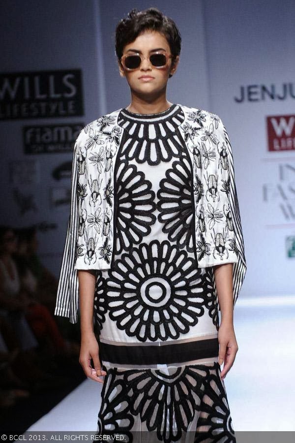 Natasha walks the ramp for fashion designer Jenjum Gadi on Day 3 of the Wills Lifestyle India Fashion Week (WIFW) Spring/Summer 2014, held in Delhi.