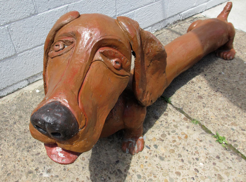 cracked left front paw on dachshund statue