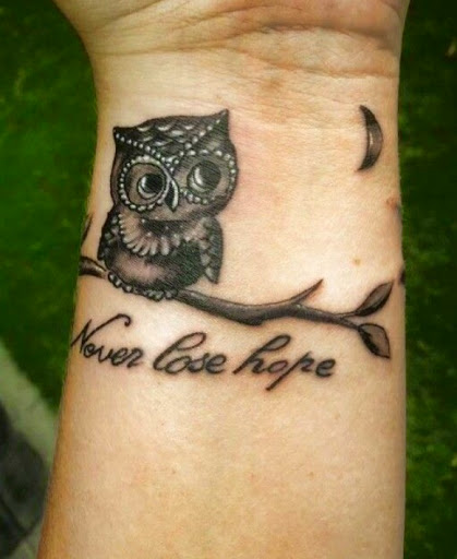 quirky owls tattoos on the wrist