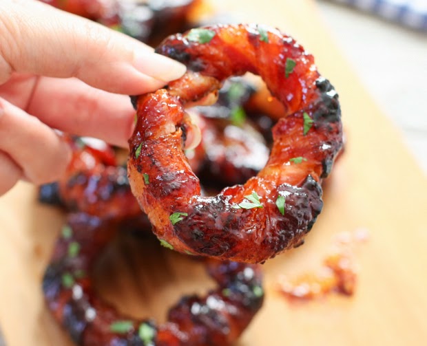 close-up photo of one Sriracha Bacon Wrapped Onion Ring