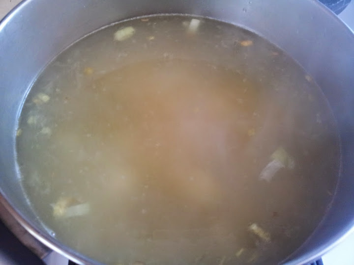 adding broth to potatos and leeks. Potato leek soup recipe