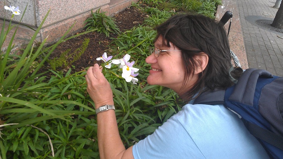 PJ Sniffing flowers.