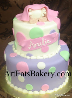 Baby bottom under blanket pink, purple, white and green fondant polka dot modern creative baby shower cake design