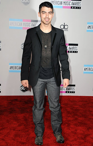 Joe Jonas on the red carpet at the 2011 American Music Awards in Los Angeles, California. November 20, 2011.