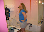 Erin getting ready in the bathroom. Yes, the room is pink and lit by green and pink lights