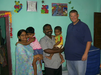 Pastor Santhosh and his family in their home