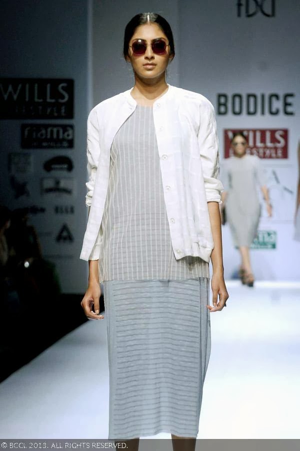 A model showcases a creation by fashion designer Ruchika Sachdev on Day 3 of Wills Lifestyle India Fashion Week (WIFW) Spring/Summer 2014, held in Delhi.