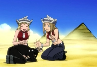 Kid lying on the ground; Liz and Patty comfort him.