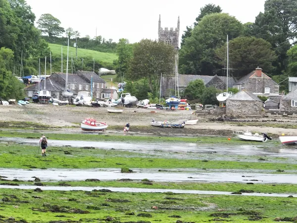 A solitary walker heads across the river unperturbed by the waters or their depths
