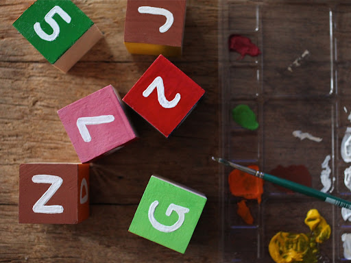 Once I had the subway colors on the cubes, I used the small detail brush to draw the letters of the subway lines in white and black. Once I had the subway colors on the cubes, I used the small detail brush to draw the letters of the subway lines in white and black.