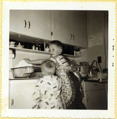 Rene washing dishes. (1956)