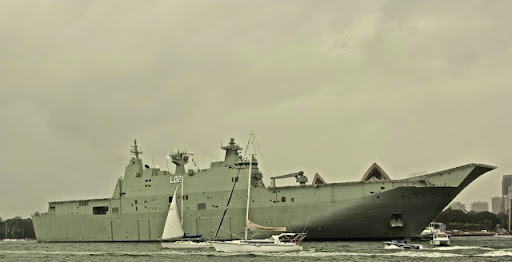 HMAS Canberra in front of the Opera House. Celebrating Australia Day in Sydney Harbour
