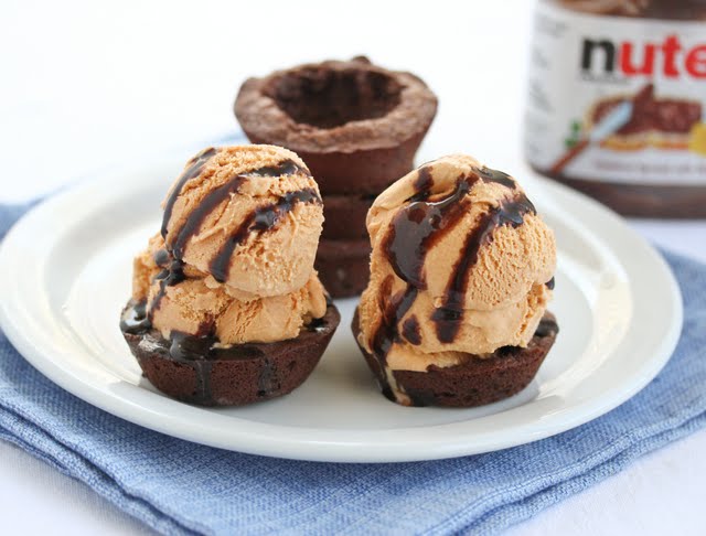 photo of two brownie bowls filled with ice cream on a plate