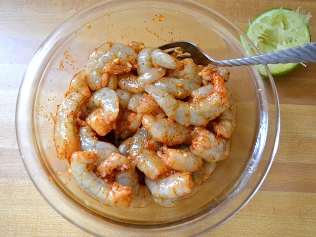 shrimp added to marinade in bowl and mixed up 