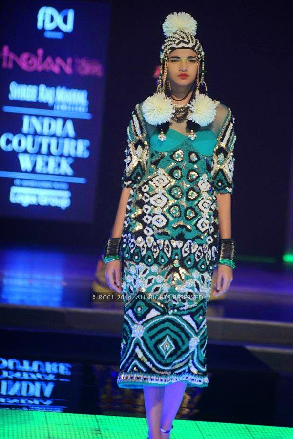 A model walks the ramp for designer Manish Arora on Day 3 of India Couture Week, 2014, held at Taj Palace hotel, New Delhi.
