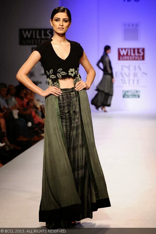 A model displays a creation by fashion designer Pallavi Singhee on Day 5 of Wills Lifestyle India Fashion Week (WIFW) Spring/Summer 2014, held in Delhi.