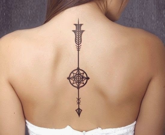 arrow tattoos on the backs of women