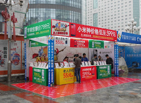 large outdoor booth selling mobile phones at Huaqiangbei