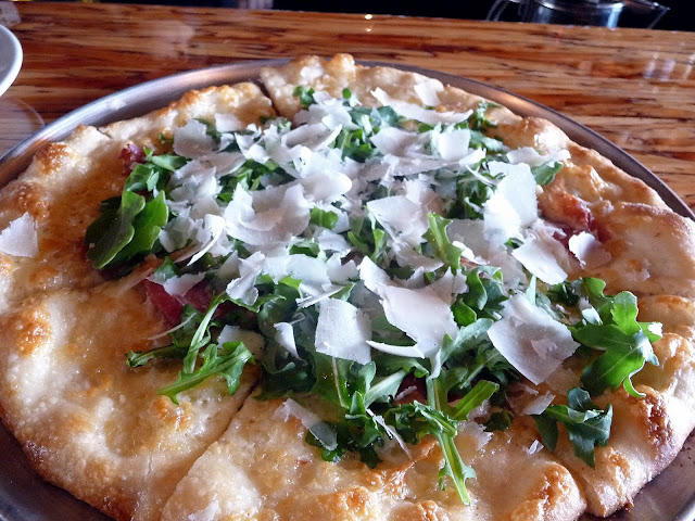 DeCarli, Beaverton, happy hour pizza, pizzetta, pizzetta with prosciutto, taleggio, arugula, shaved grana padano, olive oil