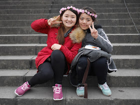 two Chinese female college students wearing flower headbands