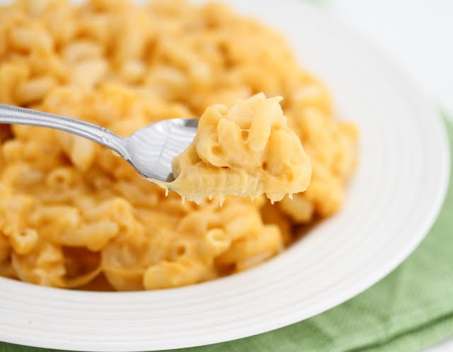 close-up photo of macaroni and cheese on a spoon