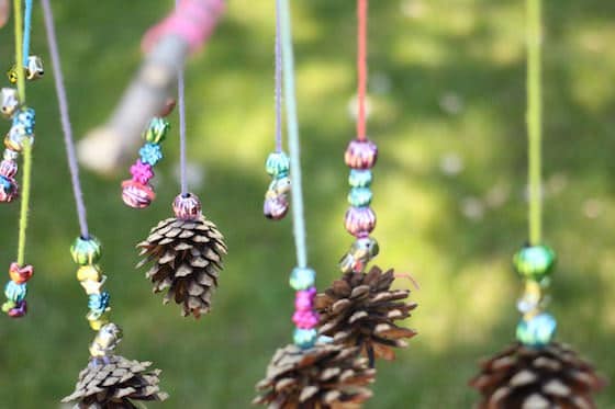 mobile-craft-with-sticks-pinecones-yarn-and-beads.jpg