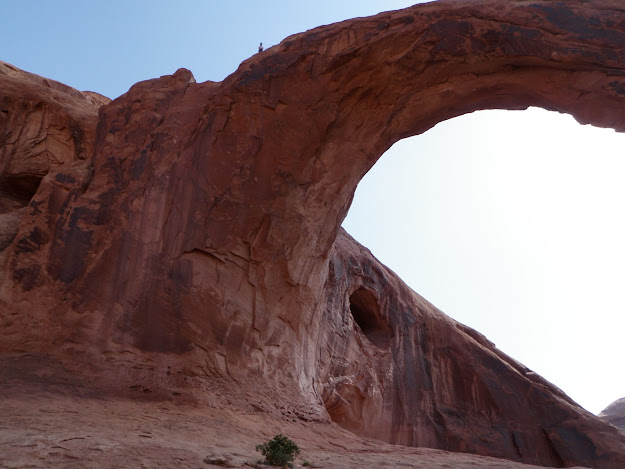 A person stands on the jump spot atop the arch