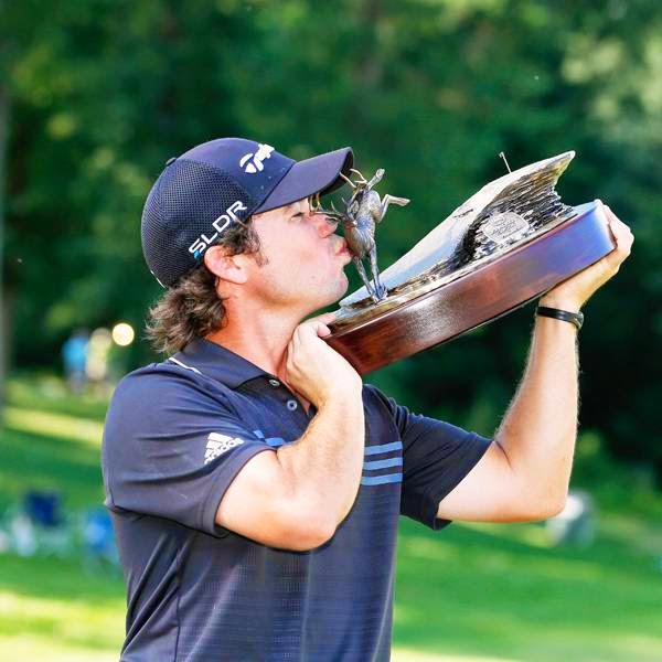Brian Harman holds the trophy after winning the John Deere Classic, held at TPC Deere Run, on July 13, 2014, in Silvis, Illinois. 